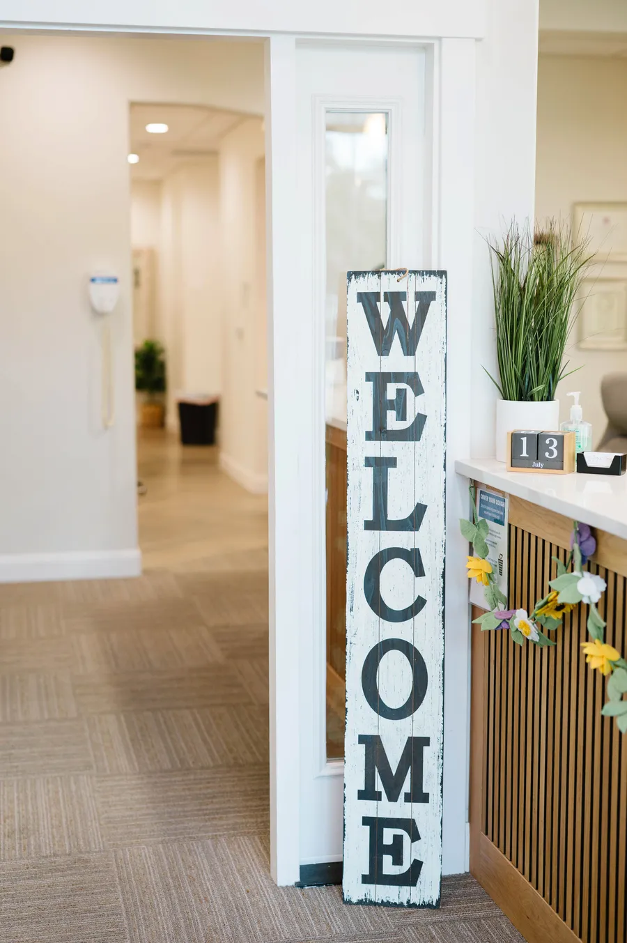 Welcome sign at the entrance of CrossPointe Dental's reception area