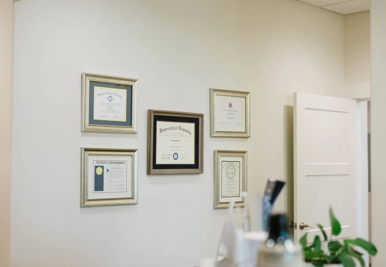 Dr. Swenson’s diplomas and professional credentials displayed at CrossPointe Dental